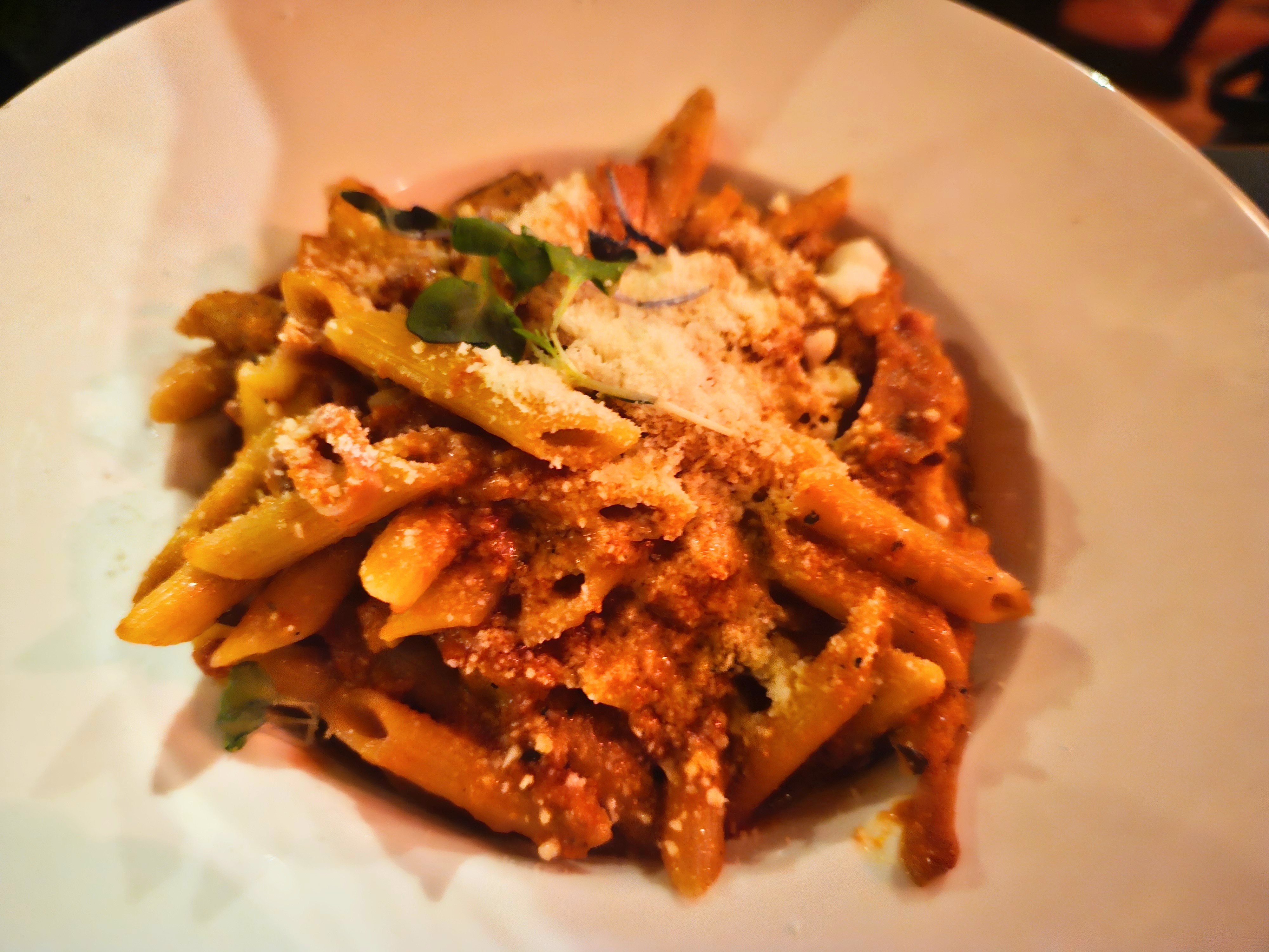 penne pasta on a table in bowl.