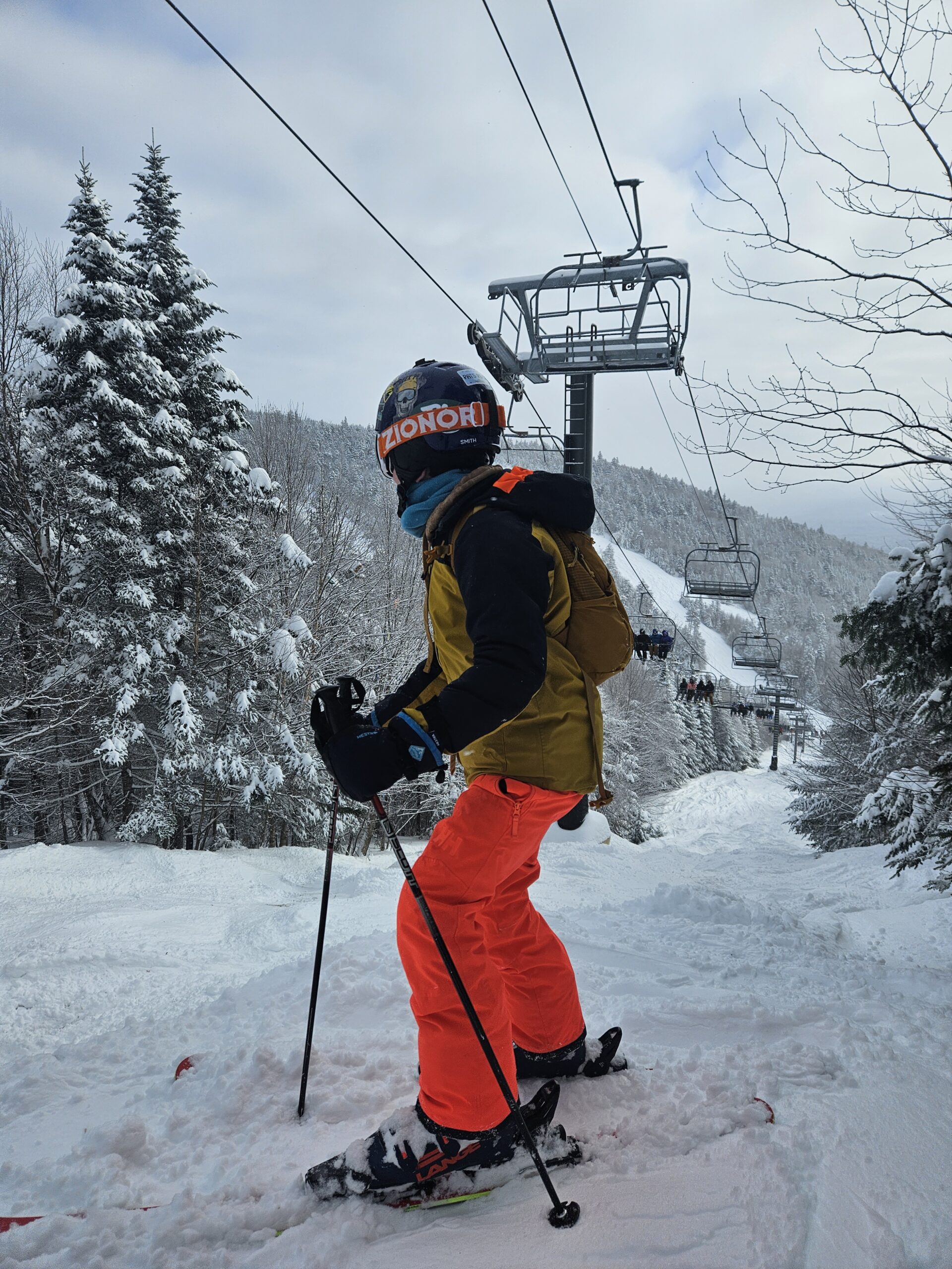 Max skiing down a snowy trail