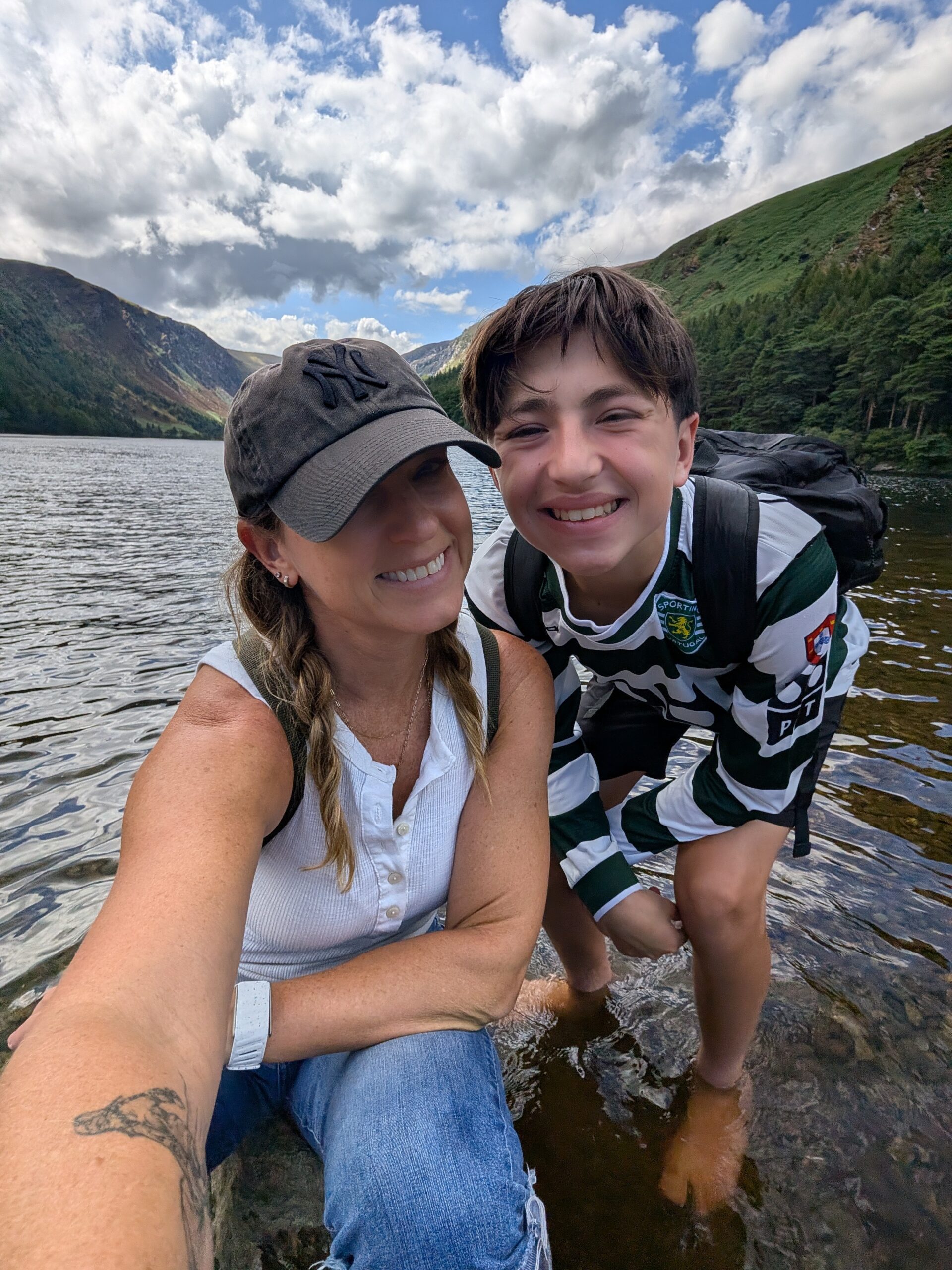 Stephanie and Max wading in a lake in the Wicklow Mountains of Ireland